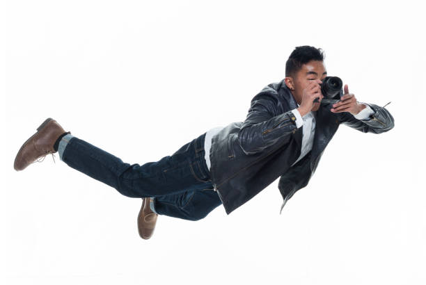 Daring young handsome male in mid air falling and jumping