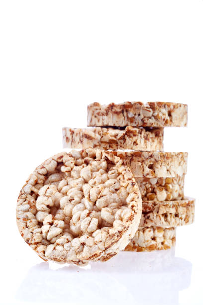 istock Round wheat crispbread, white background. Composition of crispbread on white background. 925237140
