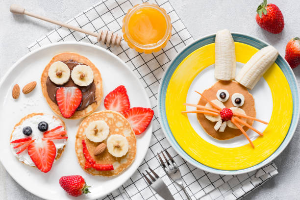 Colorful breakfast meal for kids. Funny Easter food art, top view Colorful breakfast meal for kids. Funny Easter food art, top view. Concept of healthy eating, baby food, healthy breakfast food bunny pancake stock pictures, royalty-free photos & images