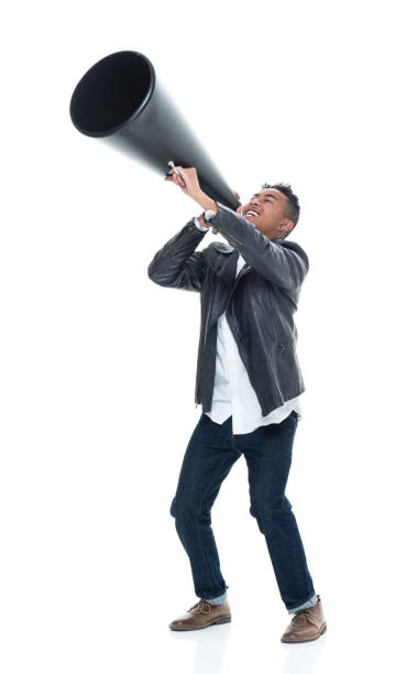 istock Dashing young man holding a large megaphone 925240668