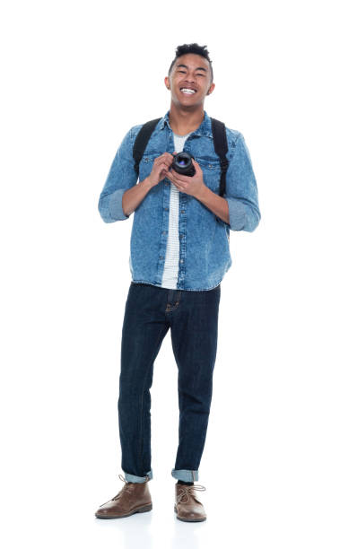istock Handsome young male holding a camera 925243890