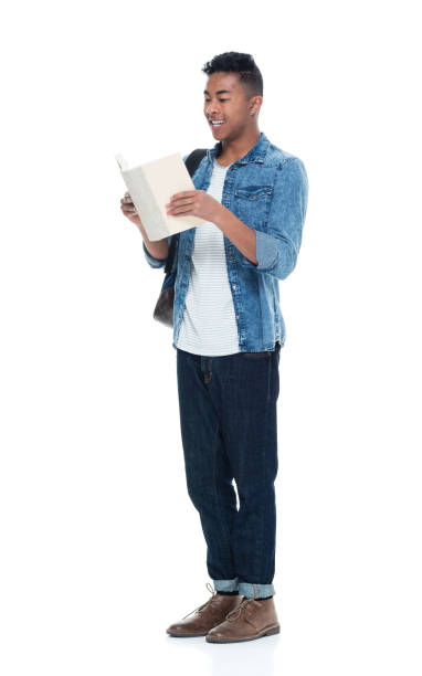 istock Hip young male student holding books 925244564