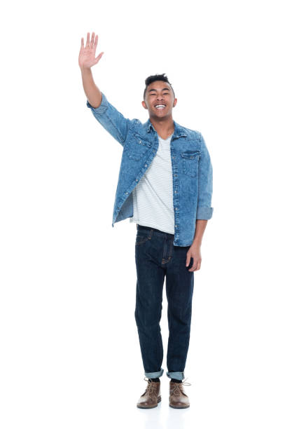 istock Handsome young male waving 925244650