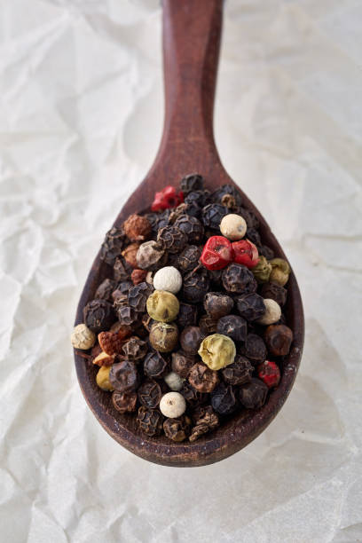 istock black pepper peas on a wooden spoon 925245374
