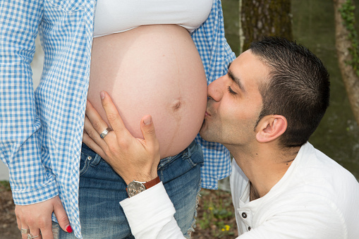 Romantic moments for Happy young pregnant couple