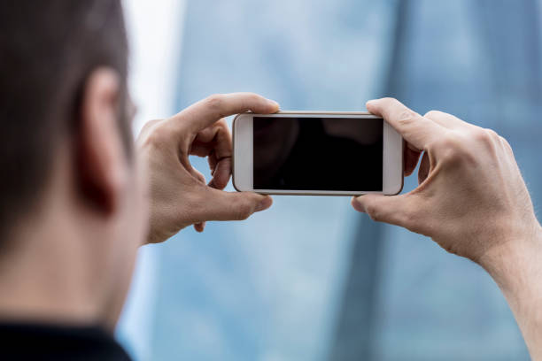 istock Man Photographing Skyscraper in Frankfurt 925247624