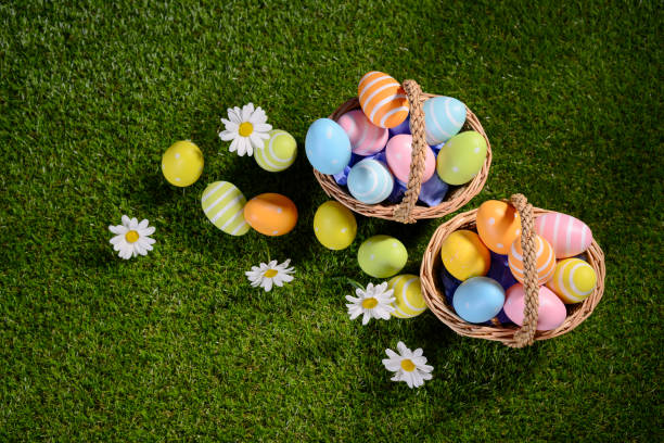 istock above top view of multi colored painted easter eggs on the green grass with springtime daisy flowers 925247666