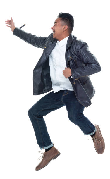 istock Good looking young man doing excited jumps 925247840