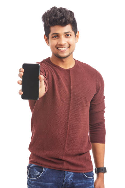 istock Cheerful Young Indian man showing smart phone 925248342