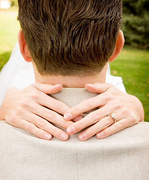 istock Bride with arms around groom 92524844