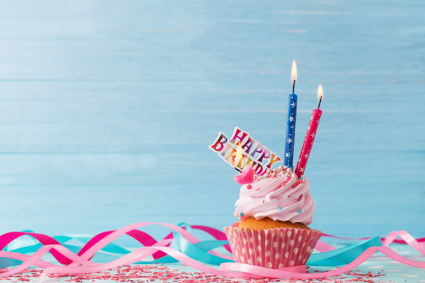 istock birthday cake on blue wooden background 925248782