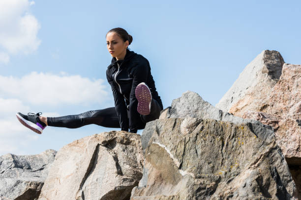 istock woman standing on hands 925259298