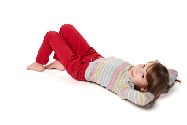 istock Child girl lying on floor looking away 925259750
