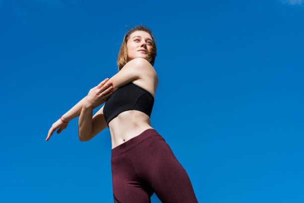 istock athleric woman stretching hand 925259900