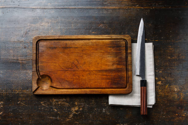istock Wooden cutting board background, cloth napkin and kitchen knife 925261480