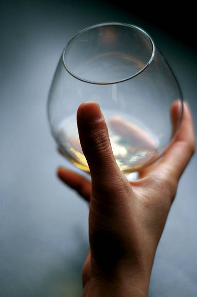 glass in hand stock photo