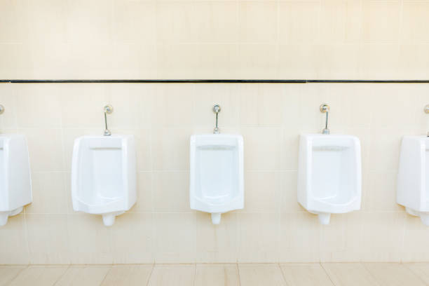 istock Public urinate for men, Restroom with ceramic urinal 925264218