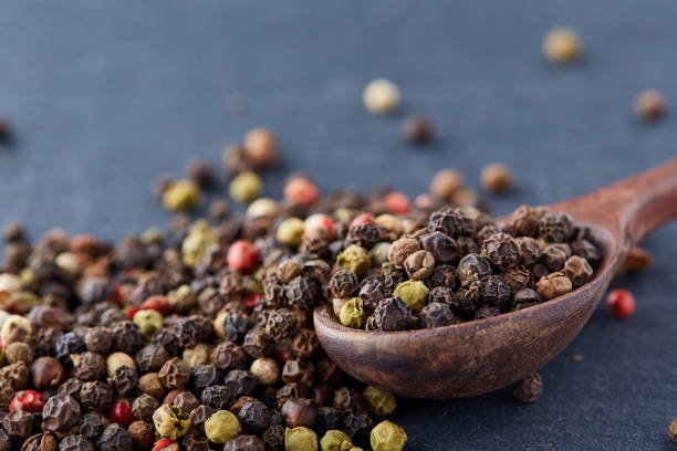 istock black pepper peas in a spoon on a stone background 925268488