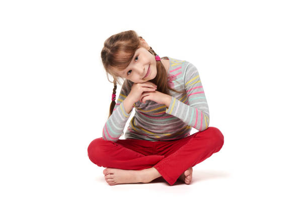 istock Girl sitting in lotus pose leaning on elbows 925268786