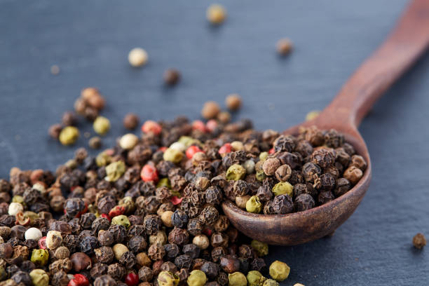 istock black pepper peas in a spoon on a stone background 925268988