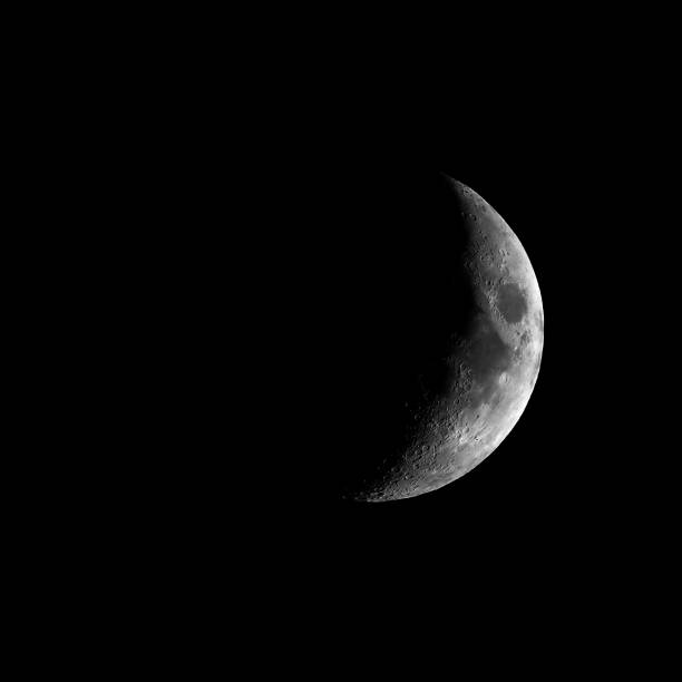 istock High contrast Waxing crescent moon seen with telescope 925273314
