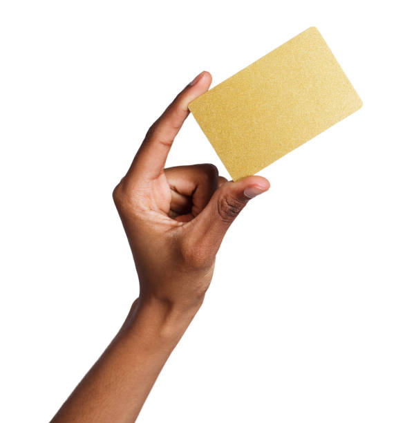 istock Female hand holding blank plastic card isolated on white 925273356