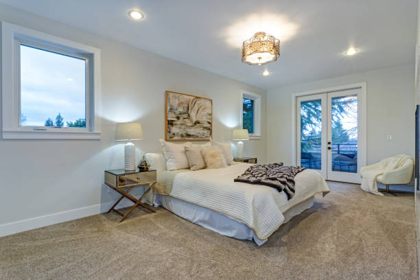 istock New luxury custom built home with white master bedroom. 925276138