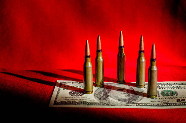 bulls in dollars and black-and-black background as an abstract symbol of the causes of military conflicts in the world and tragedies and murders - blood bank imagens e fotografias de stock