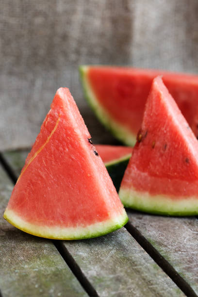 istock Slices of watermelon on wooden surface. 925283900