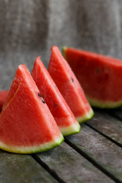 istock Slices of watermelon on wooden surface. 925284120