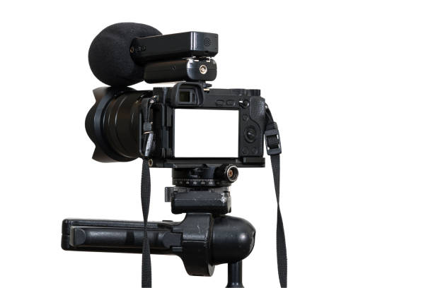 istock A Professional digital mirrorless camera on tripod with microphone for record on white background, Camera for photographer or Video, Live Streaming equipment concept,  include clipping path 925284322