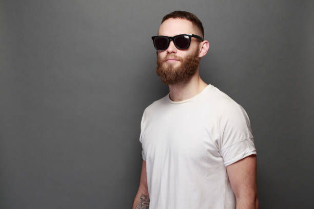 istock Hipster handsome male model with beard wearing white blank t-shirt 925284712