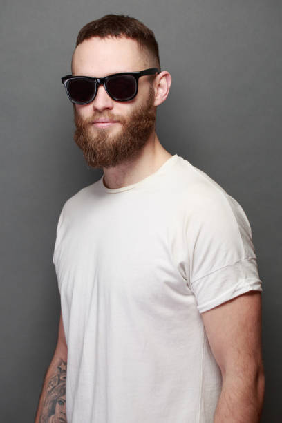 istock Hipster handsome male model with beard wearing white blank t-shirt 925284890