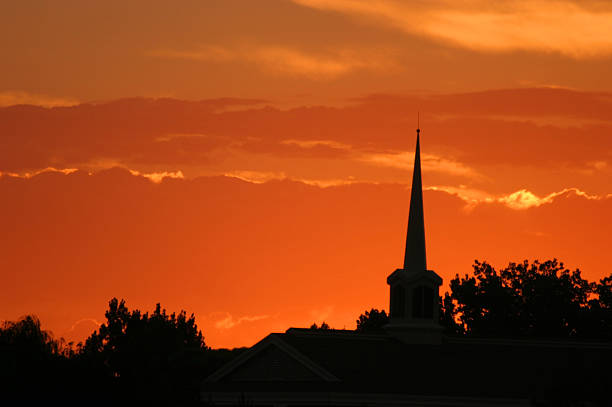 istock Solitary Silhouetted Steeple Spire Pierces Sunset 92528709