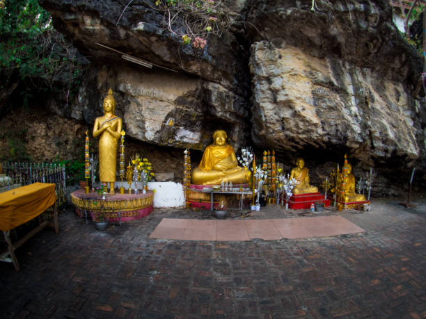 istock Buddha stat.ue on the way in phusi hill, Mount Phousi, Luang Prabang, Laos 925287710