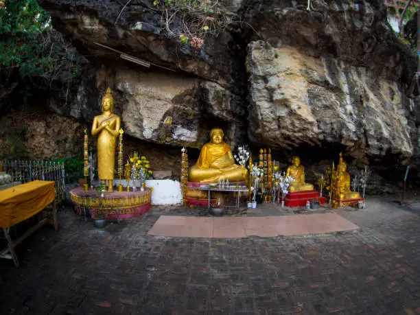 Photo of Buddha stat.ue on the way in phusi hill, Mount Phousi, Luang Prabang, Laos