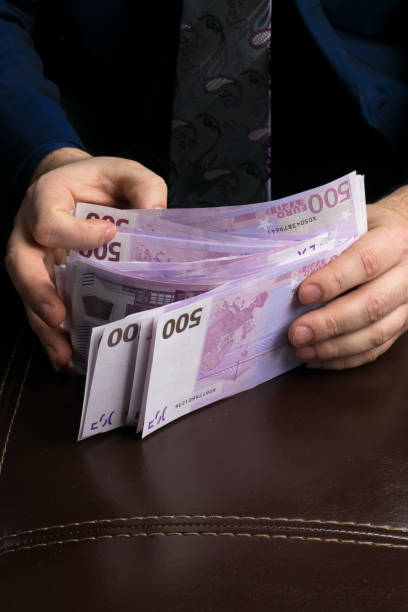 istock man counting money cash 925287768