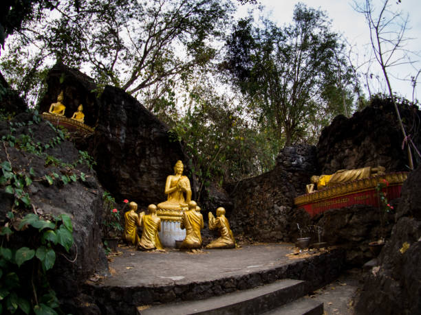 istock Buddha stat.ue on the way in phusi hill, Mount Phousi, Luang Prabang, Laos 925287844