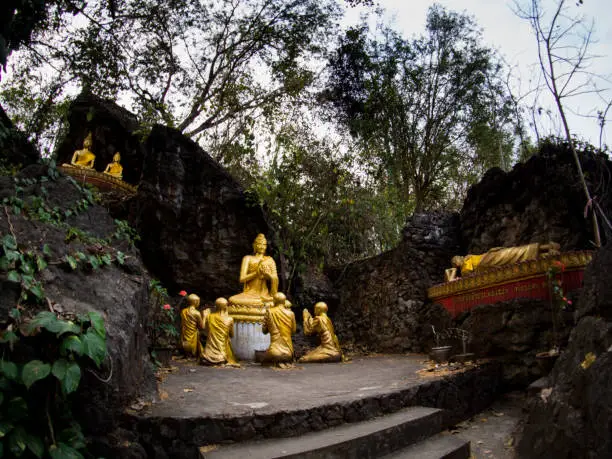 Photo of Buddha stat.ue on the way in phusi hill, Mount Phousi, Luang Prabang, Laos