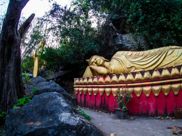 Photo of Buddha stat.ue on the way in phusi hill, Mount Phousi, Luang Prabang, Laos