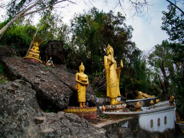 Photo of Buddha stat.ue on the way in phusi hill, Mount Phousi, Luang Prabang, Laos