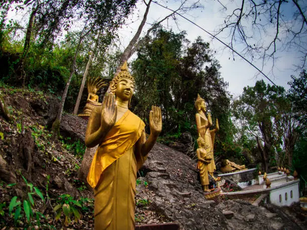 Photo of Buddha stat.ue on the way in phusi hill, Mount Phousi, Luang Prabang, Laos