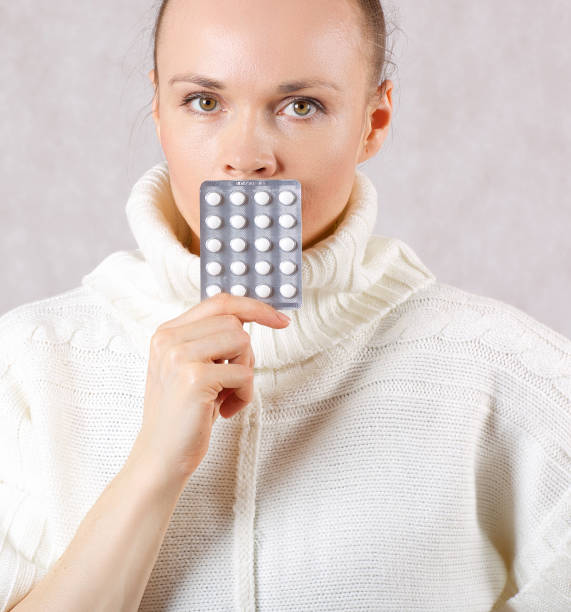 istock Young caucasian lady shows some medication. 925288214