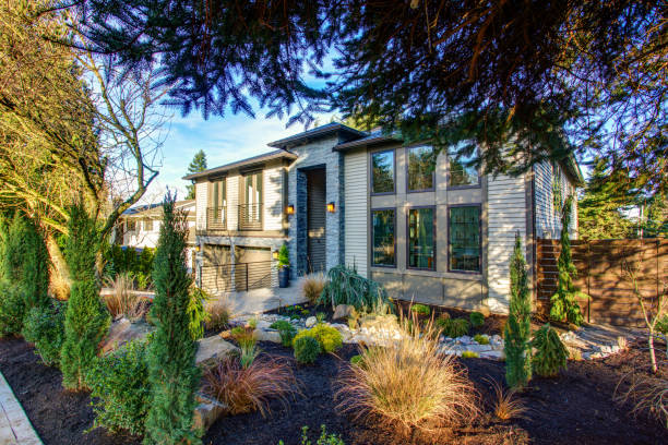 istock New construction home exterior with perfectly landscaped front yard 925288306