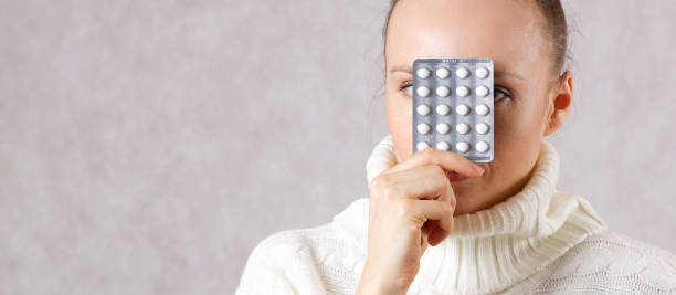 istock Young caucasian lady shows some medication. 925288440
