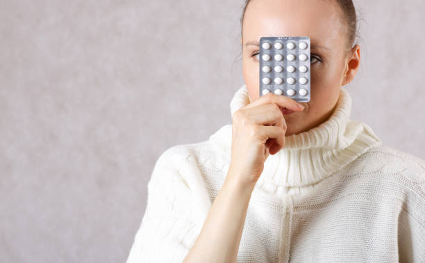 istock Young caucasian lady shows some medication. 925288446