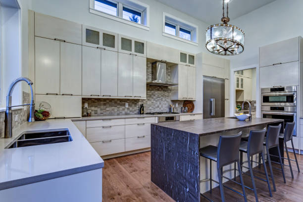 istock Contemporary white kitchen with high-end kitchen appliances 925289224