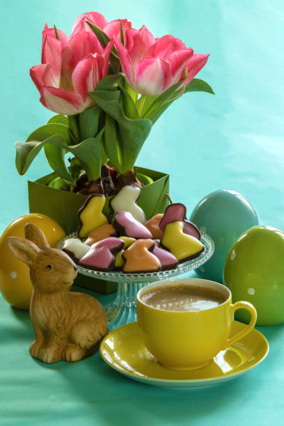 istock Still life with easter bunny, flowers, cup of coffee, candies and ceramic eggs 925291870