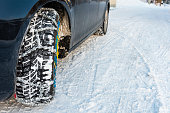 Car with mounted snow chains