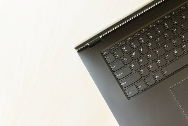 istock Gray laptop on table top-down view  home office clean with empty space for copyspace wording and text.  Internet wifi office concept. 925295454